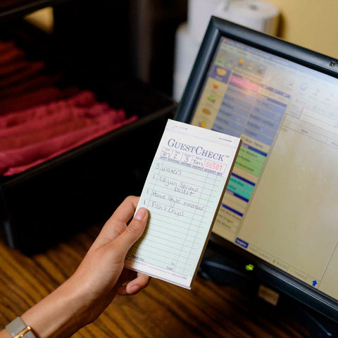 National Checking Company Carbonless Guest Check Paper - 2 Part Green, 19 Line, 3.4 x 6.75 inch -- 2500 per case.