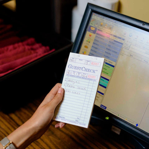 National Checking Company Guest Check Paper - 1 Part Green, 17 Line, 3.5 x 6.75 inch -- 50 per case.