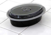 Pactiv VERSAtainer Polypropylene Microwaveable Black Oval Takeout Container and Clear Lid, 16 Ounce Capacity -- 150 per case