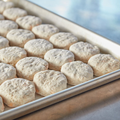 General Mills Pillsbury Unbaked Garlic Cheddar Biscuit Dough, 1.2 Ounce -- 210 per case.